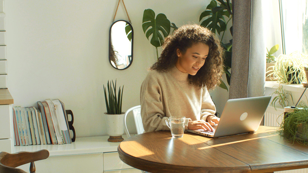 Woman using her laptop at home.