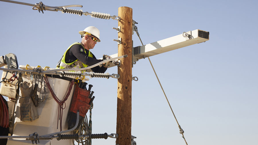 aps linemen working on a power line