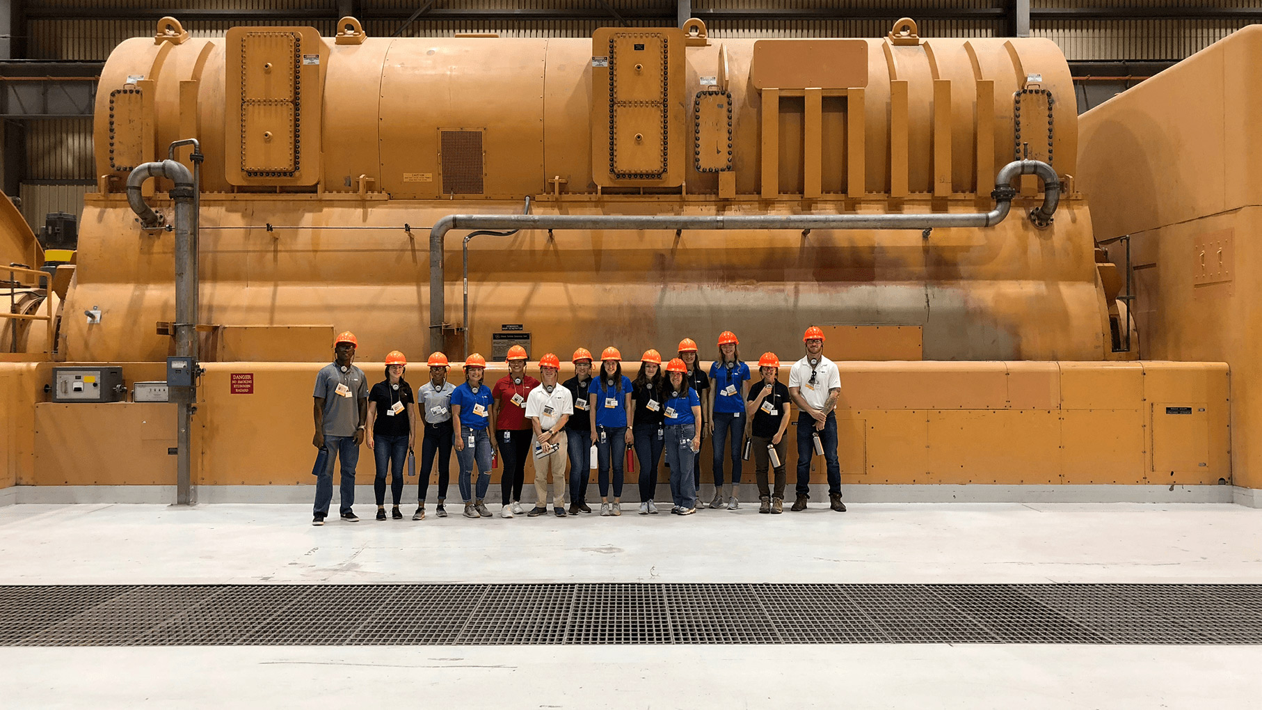 Interns standing in front of the Palo Verde nuclear generator.