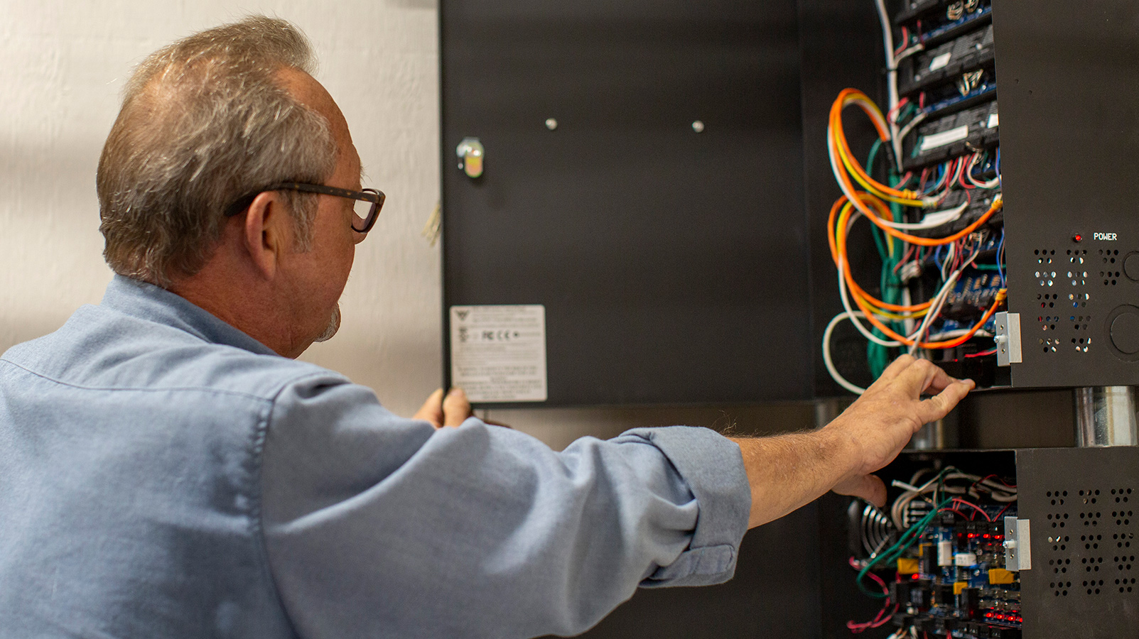 APS employee working with wires.