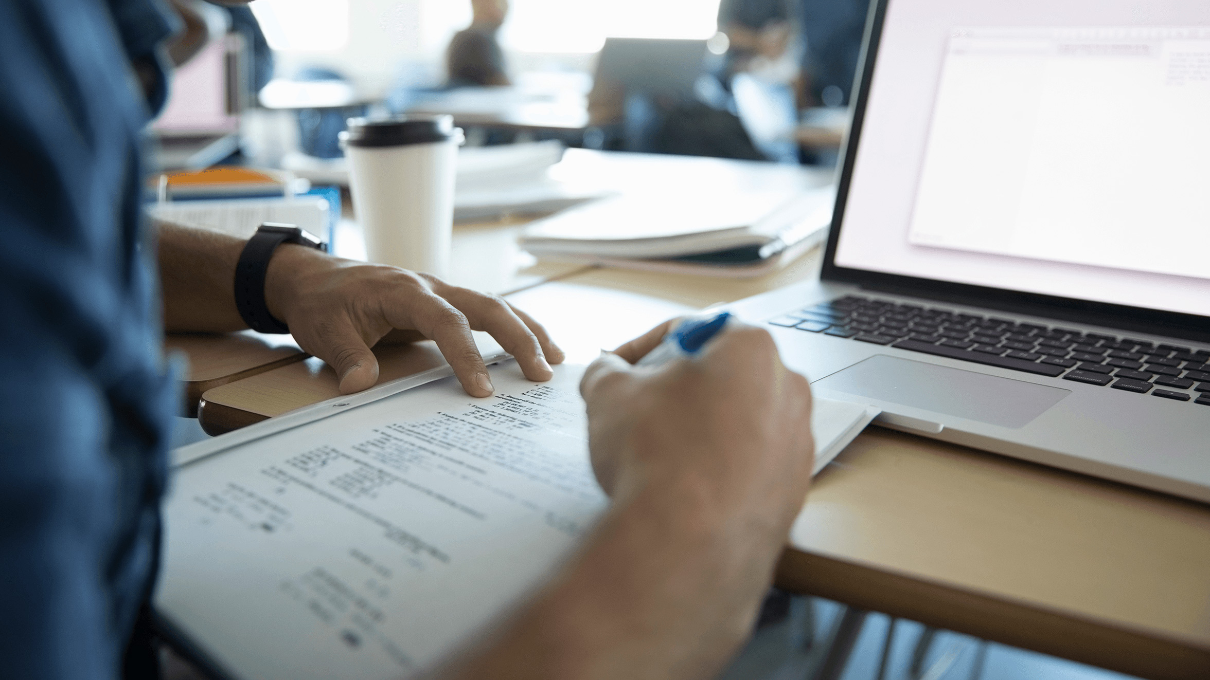 Man reading over a document.