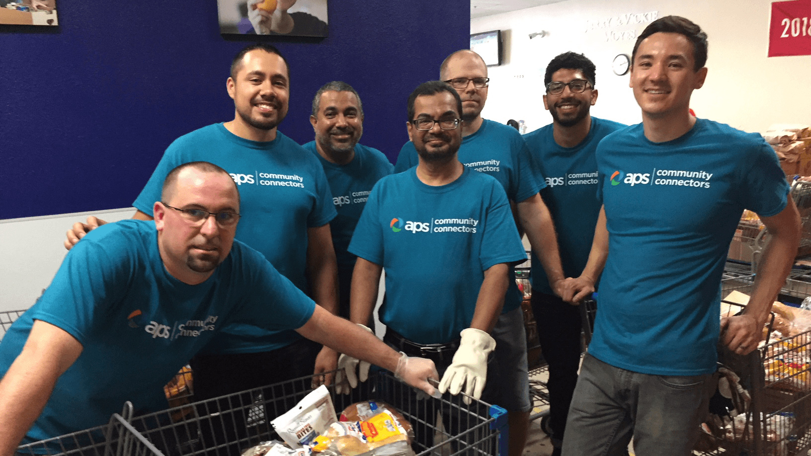 Group of APS employees volunteering at food bank.
