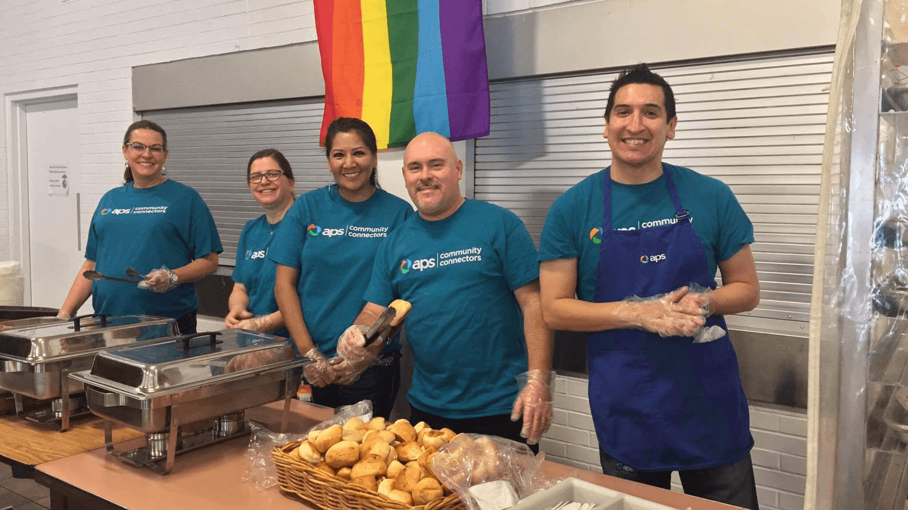 Group of APS employees volunteering in food line.