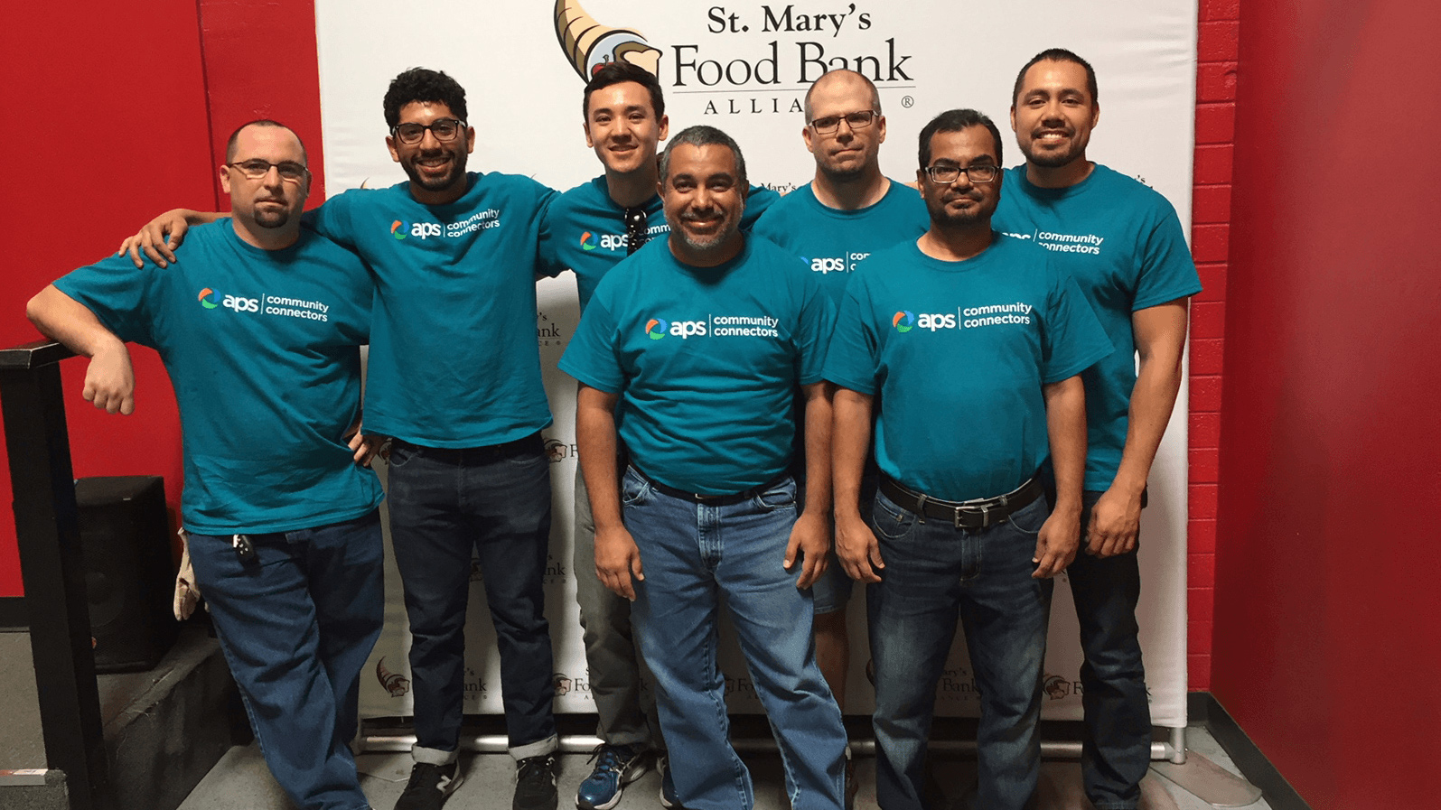 Group of APS employees volunteering at St. Mary's Food Bank.