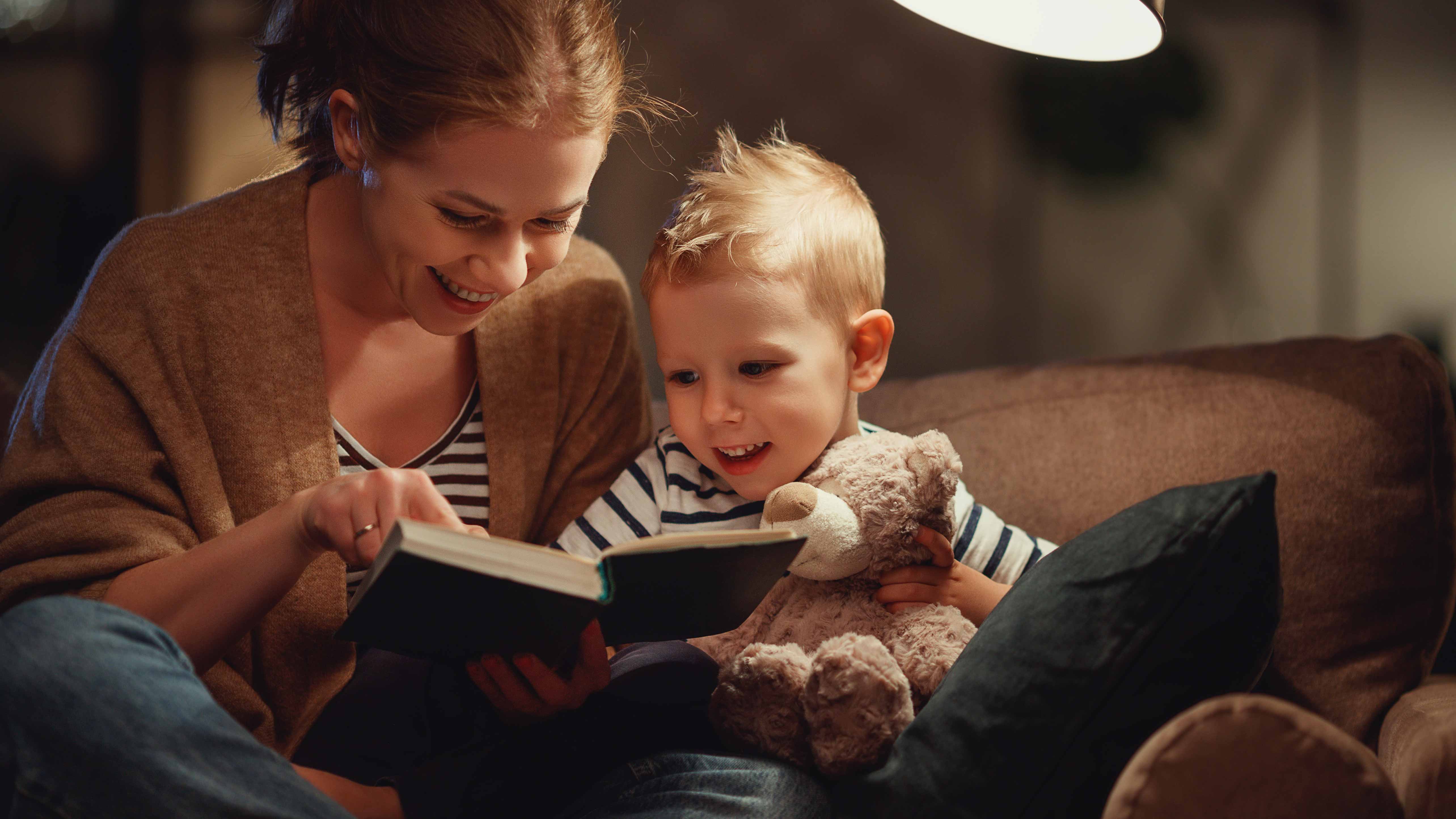 Mother reading to young son