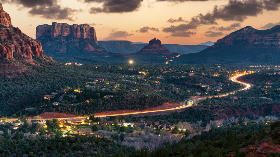 Sedona in the evening with lights on the highway