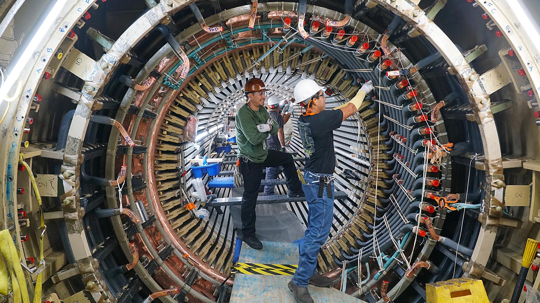 Workers in a turbine generator.