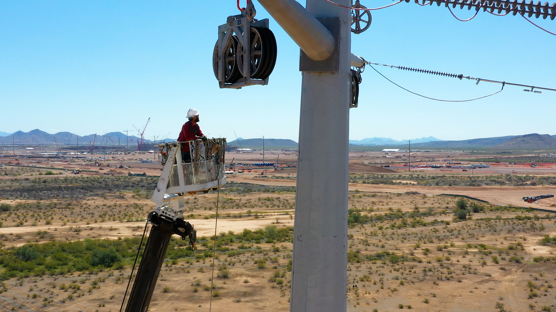 close up view of a lineman working on a pole