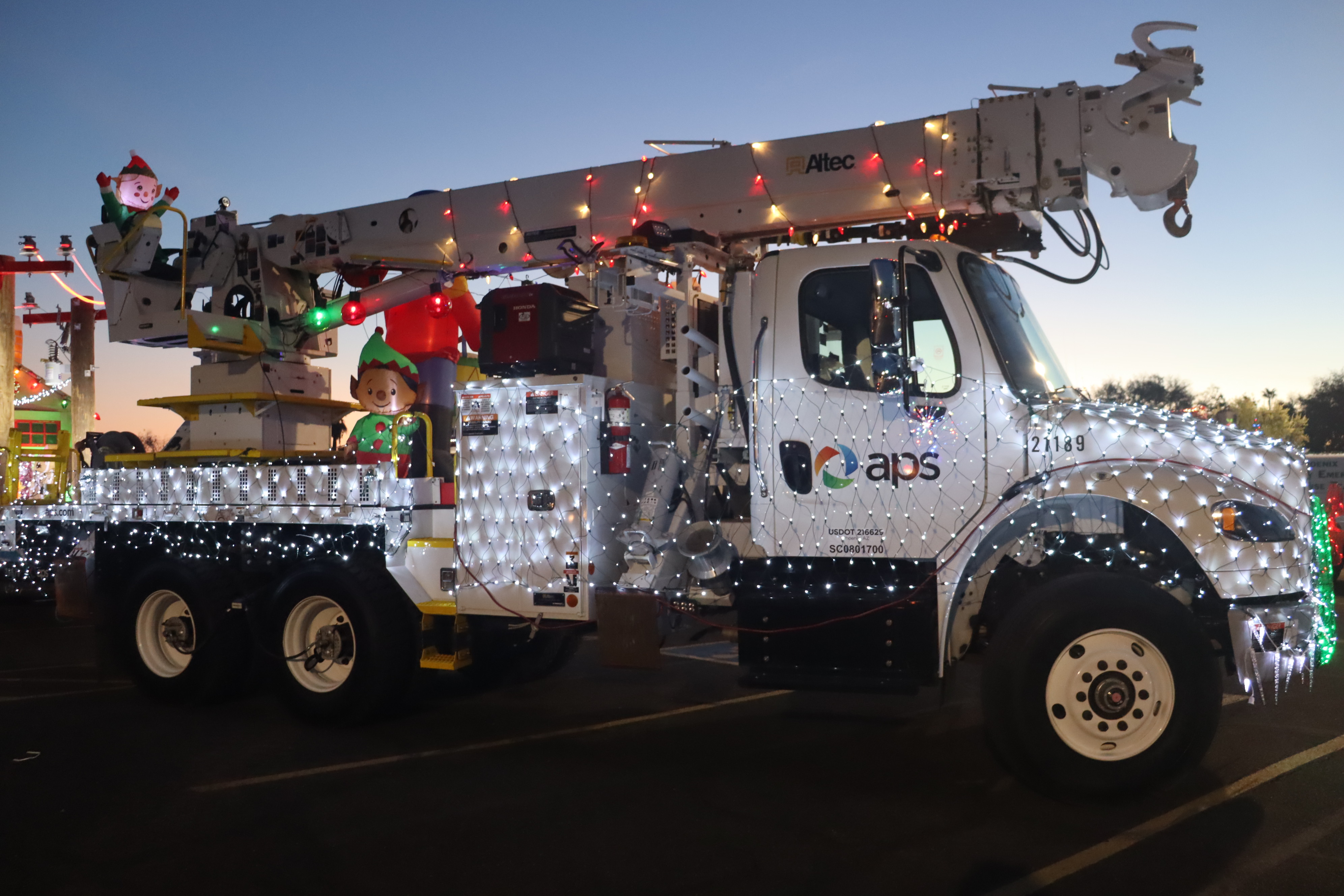 Boom truck with holiday lights on it