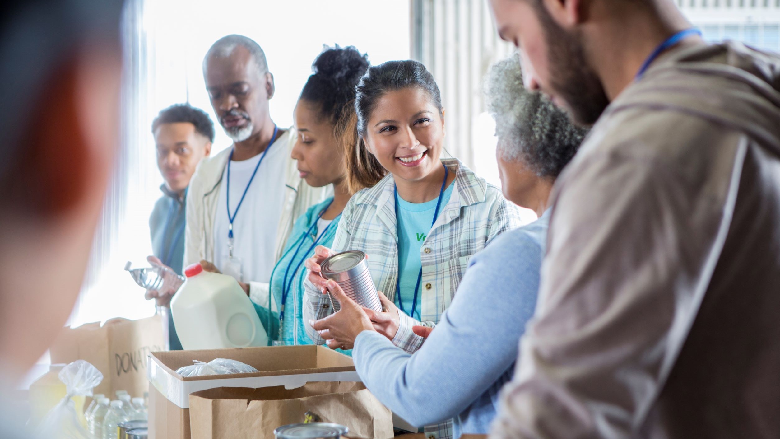 Volunteers packing boxes of food