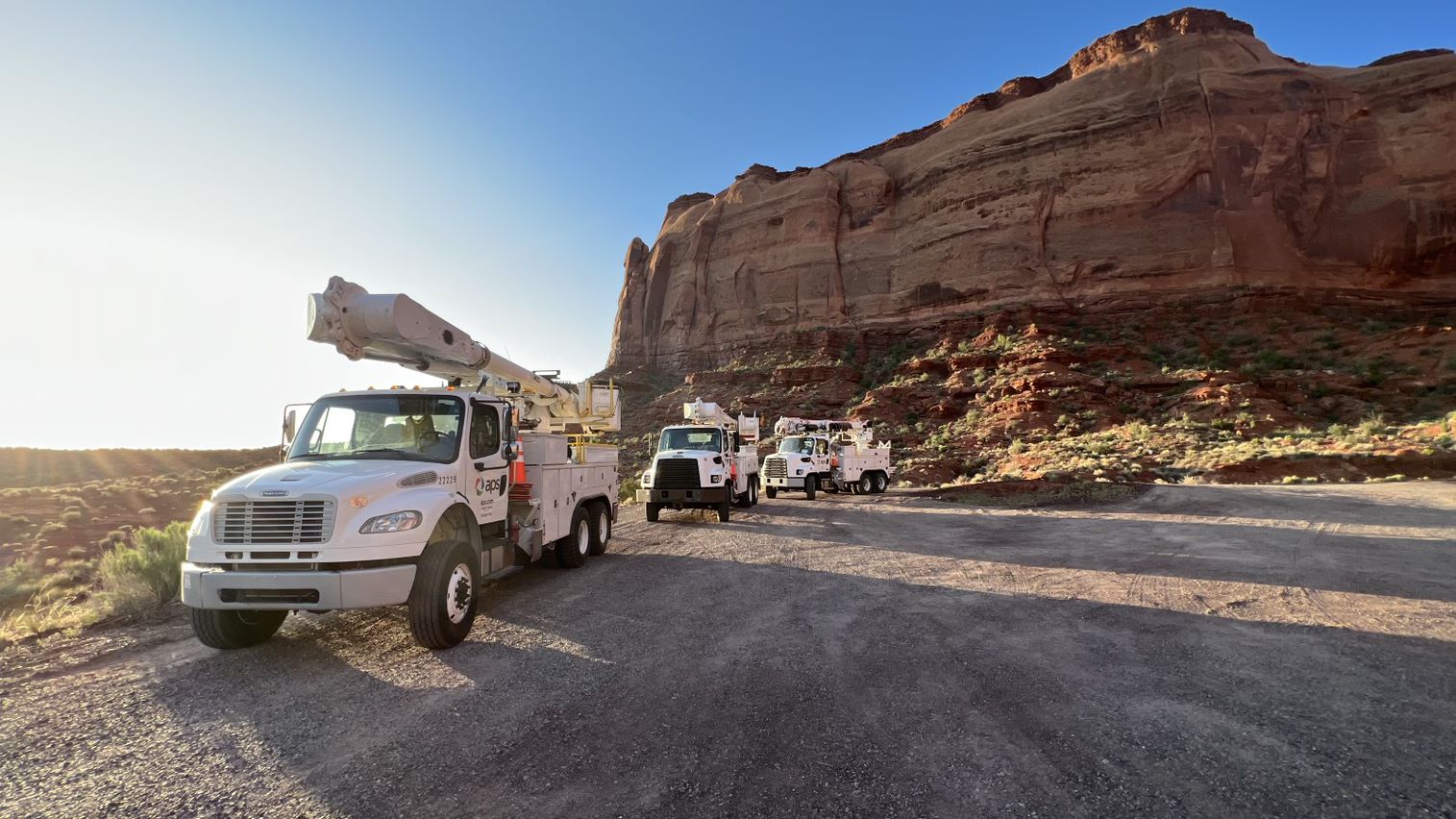 Lineworker trucks desert
