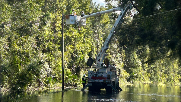 APS Lineworkers repairing a damaged pole
