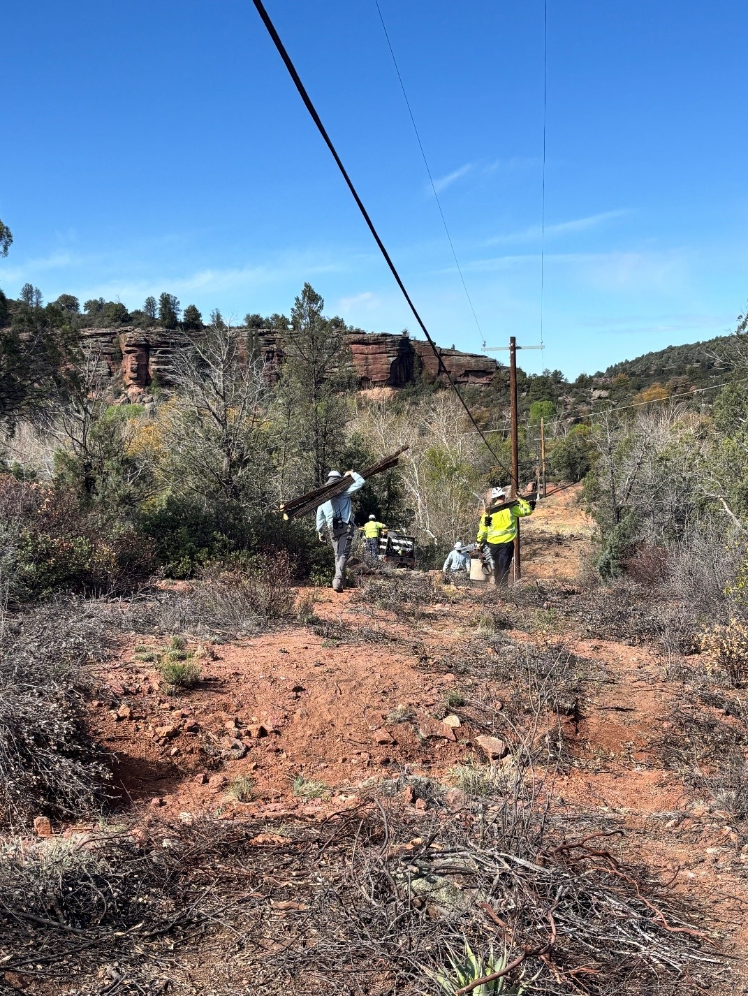 Crews walking with tools near Payson, Arizona