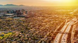 Far away view of a Phoenix freeway with sunset