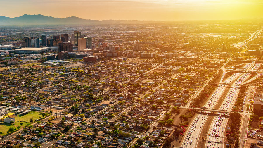 Far away view of a Phoenix freeway with sunset