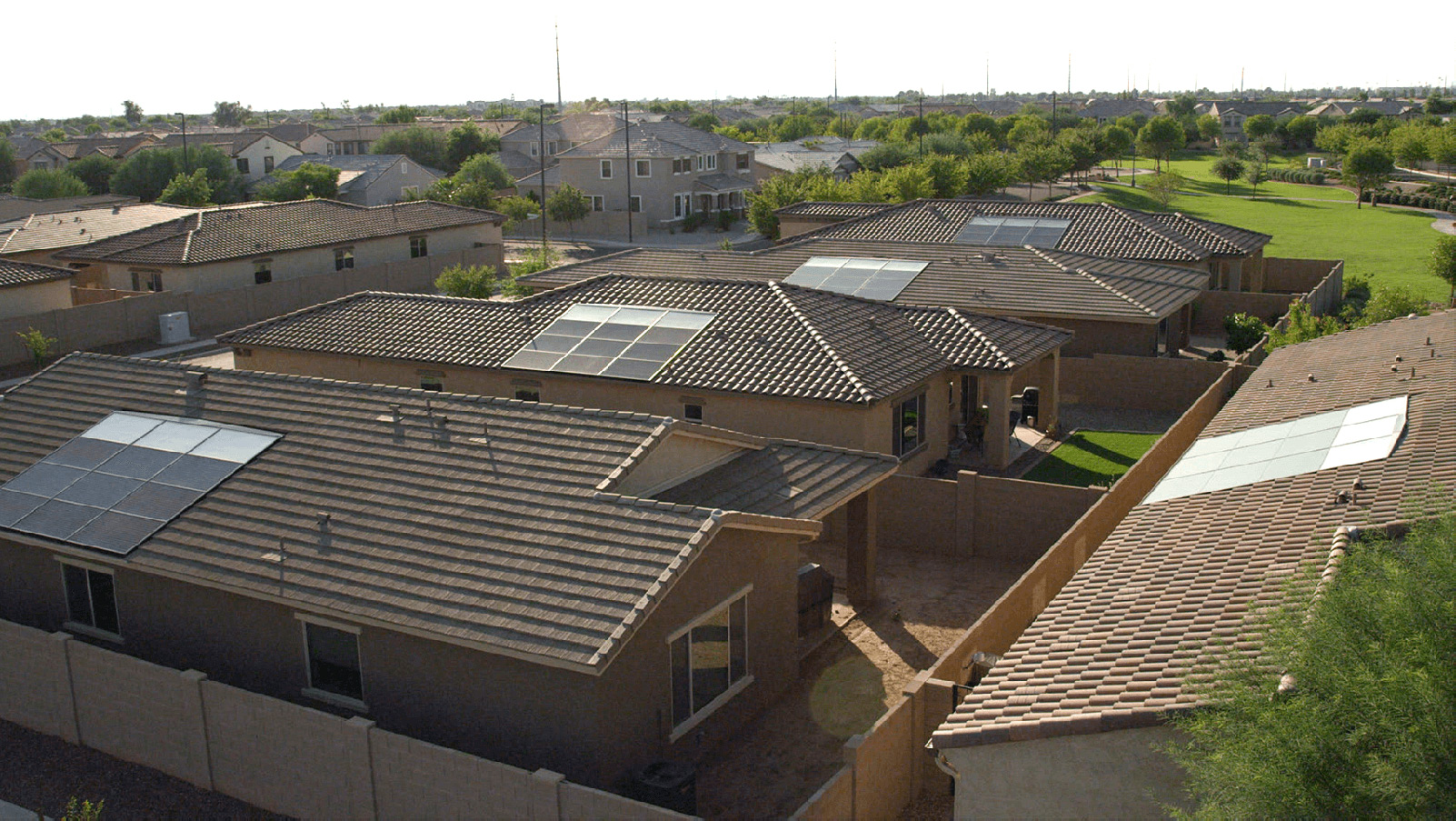 Residential homes with rooftop solar panels.