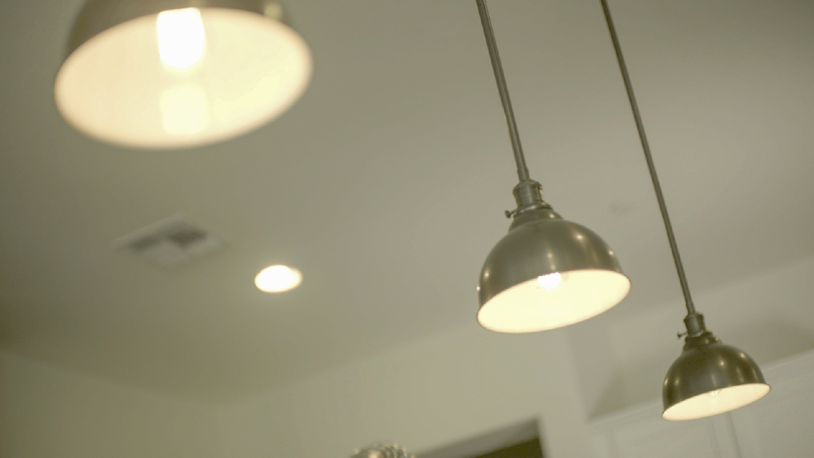 Light fixtures hanging from a ceiling.