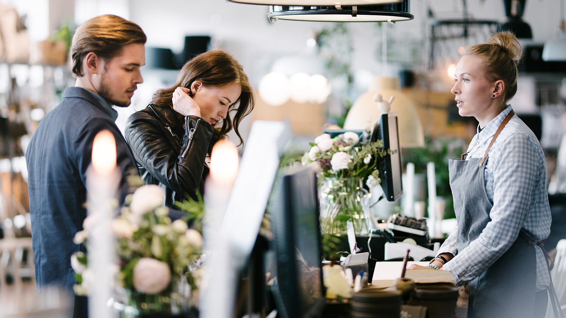 Retailer assisting customers 