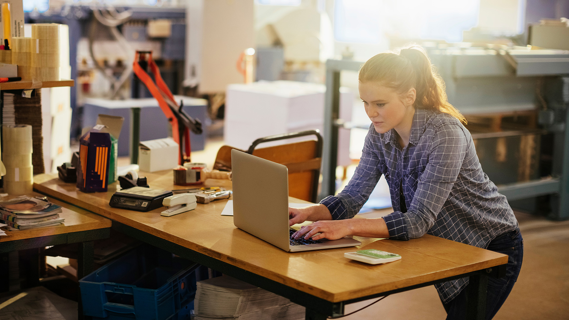 Woman using her laptop at her desk