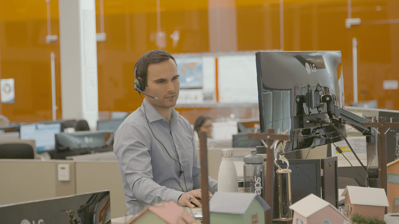 Call center employee looking at the computer.