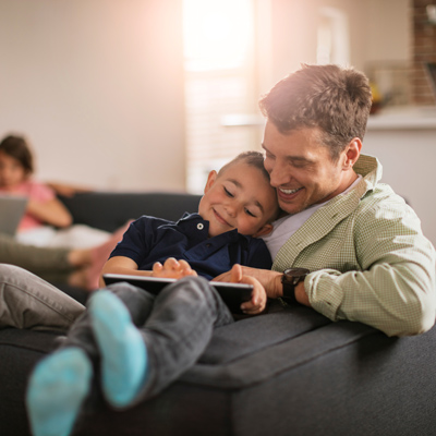 Father with son on couch