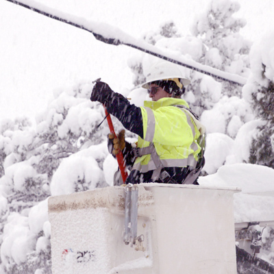 APS Line worker in the snow