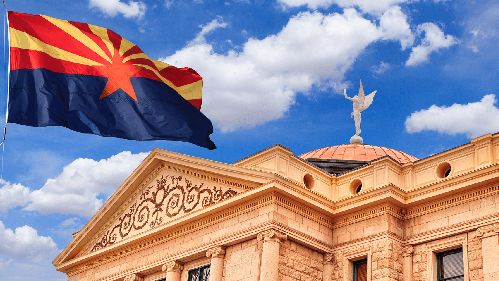 Arizona state capitol building with the state flag.