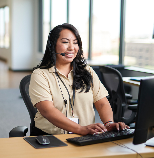 Customer Service representative at a desk