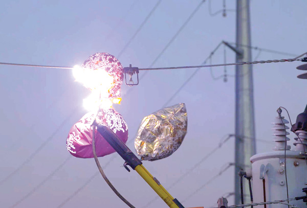 Mylar balloons causing a spark on a power line