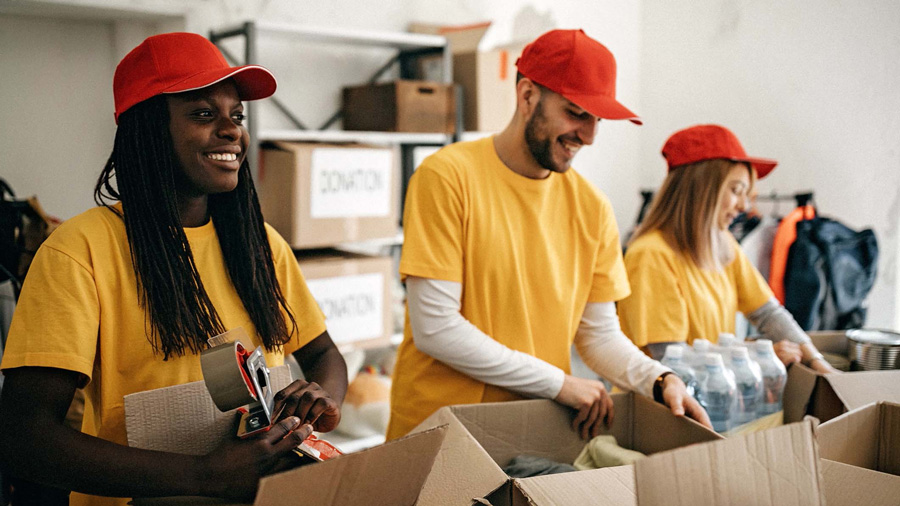 Volunteers packing supply boxes