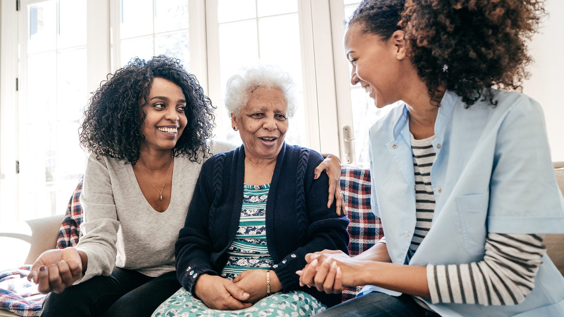 Family sitting together on a couch.