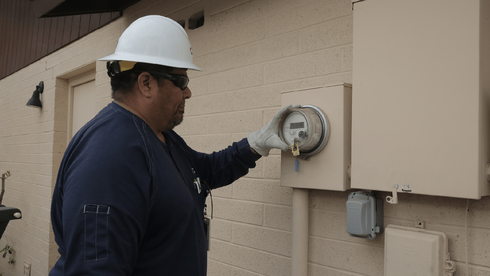 APS employee reading a meter.