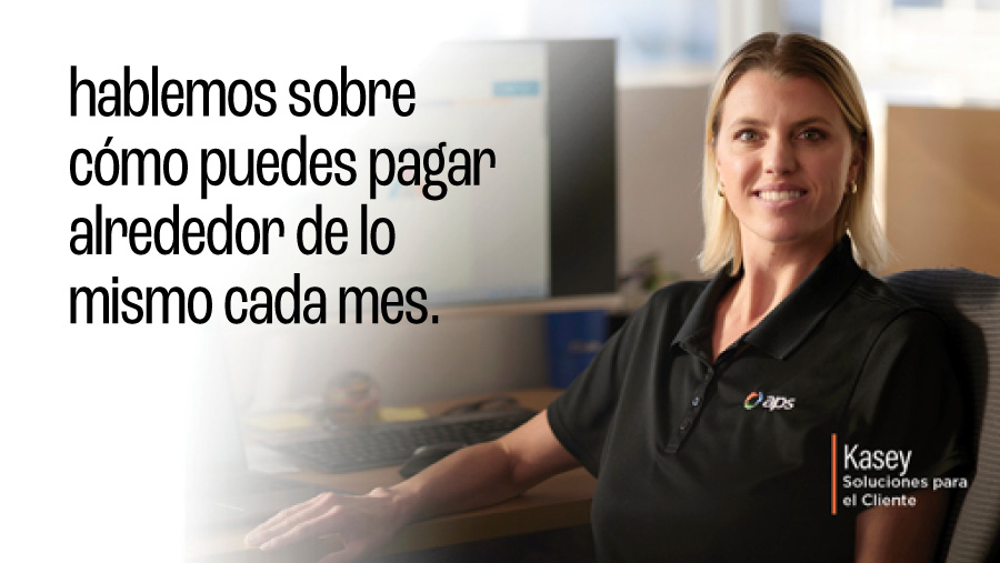 Woman adjusting her thermostat