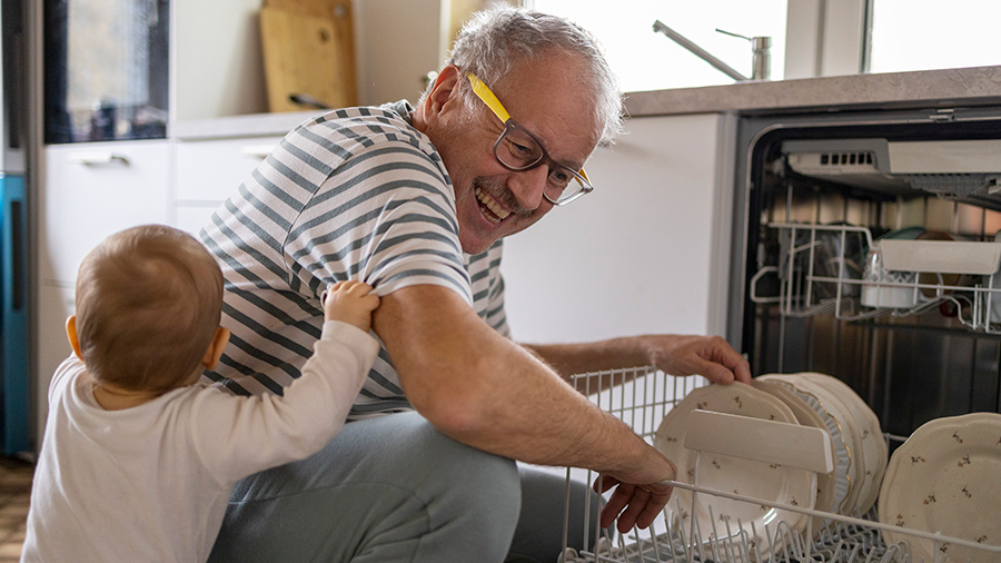 Grandpa loading the dishwasher