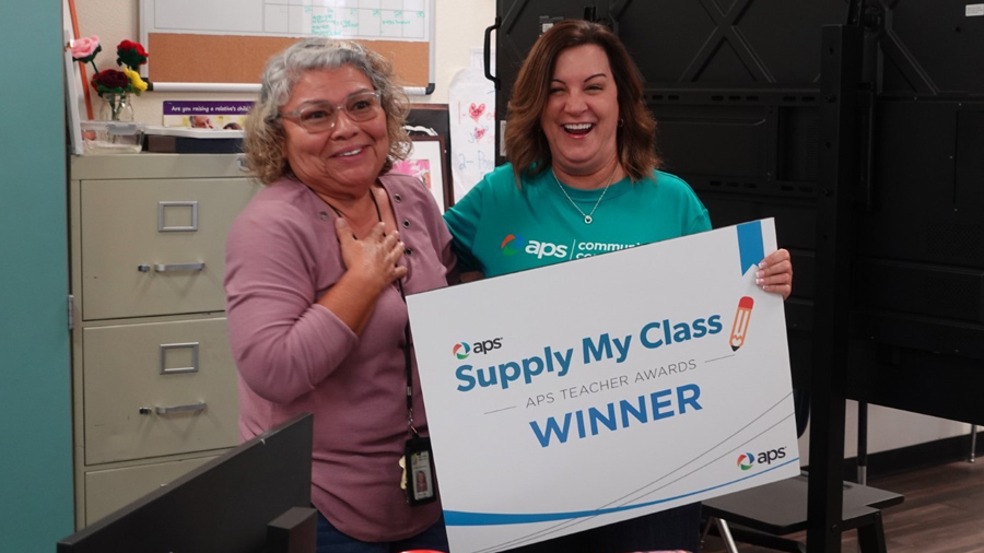 Teachers with winner check from Supply My Class