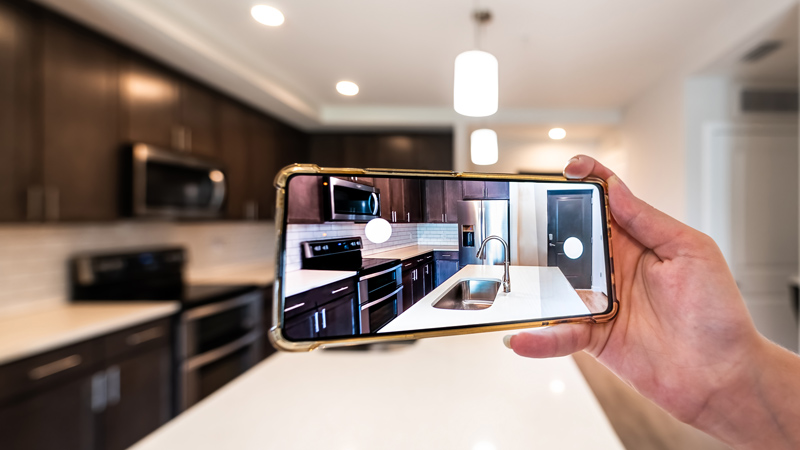 Man using a mobile phone to show his home