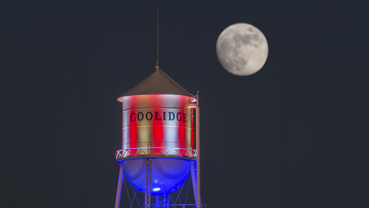Coolidge Water Tank against a moonrise